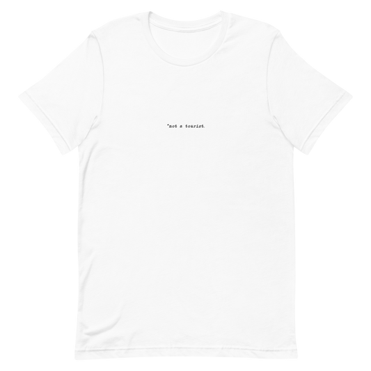 *not a tourist Short-Sleeve Unisex T-Shirt (center)