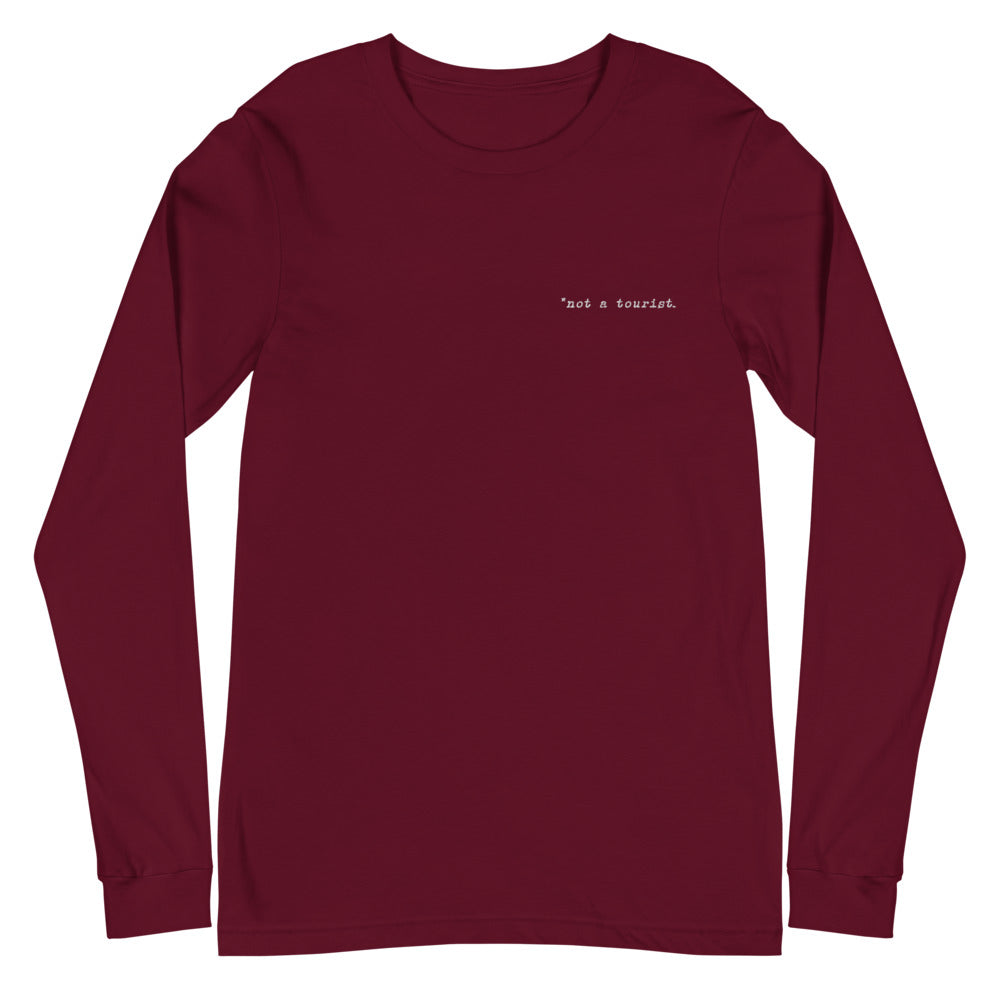 *not a tourist Unisex Long Sleeve Tee (left)