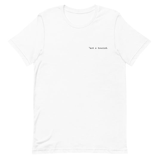 *not a tourist Short-Sleeve Unisex T-Shirt (left)