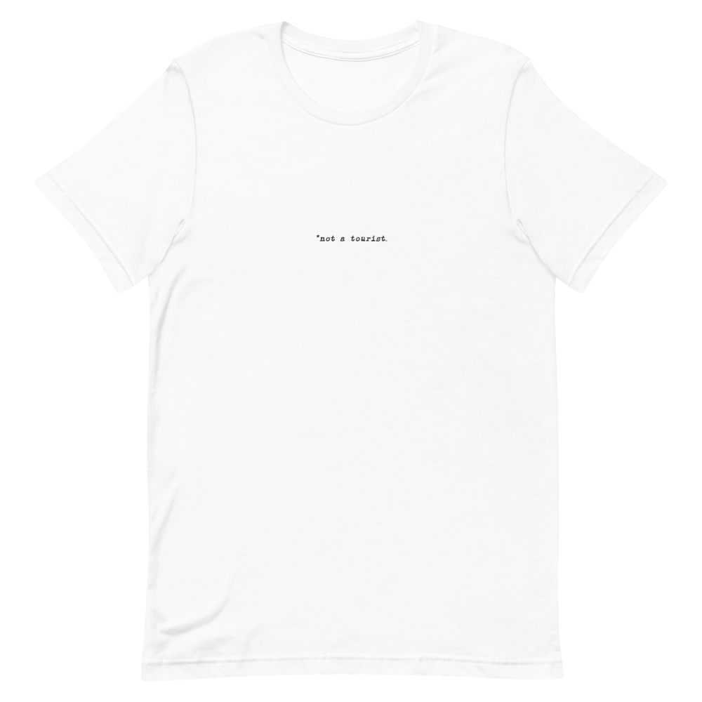 *not a tourist Short-Sleeve Unisex T-Shirt (center)