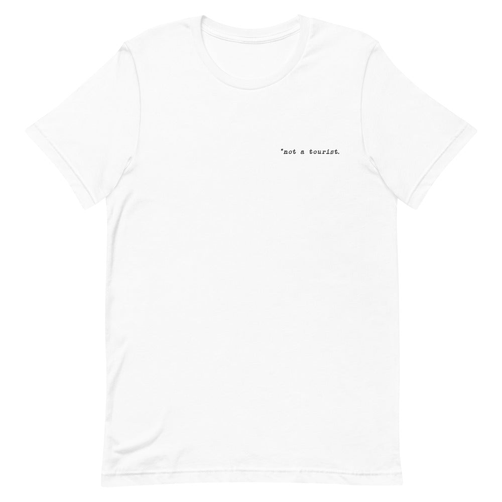 *not a tourist Short-Sleeve Unisex T-Shirt (left)